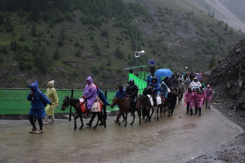 pilgrims-accompanied-by-pony-operators-and-porters-continue-their-journey-along-the-baltal-route-during-rain-on-the-annual-amarnath-yatra-in-jammu-and-kashmir-in-july-2026-a15dc1d07f43a6d56e6ae41ff6c0a0161785864192.jpeg