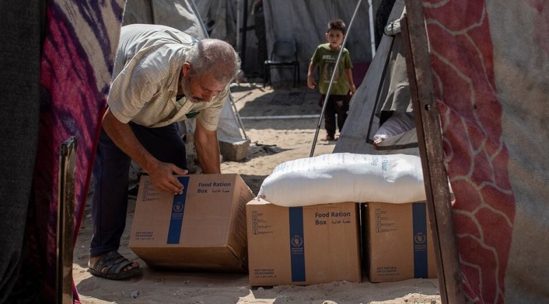 a-displaced-family-receives-food-aid-at-a-displaced-camp-in-northern-gaza-da40c2dd7153164ab361fffb17041cf91790832765.jpg
