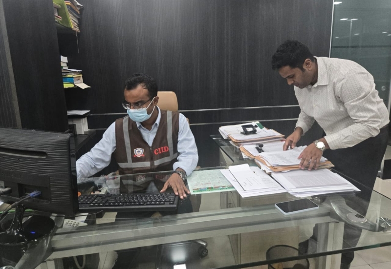 customs-intelligence-members-checking-documents-at-a-warehouse-18b1a18d846cc30ce37a0afa30449ba31790919148.jpg