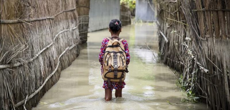 flood-a-child-wades-through-water-on-her-way-to-school-in-kurigram-district-of-northern-bangladesh-august-2016-f9f6849db7006db80b8cca5d664964ff1645725068.jpg