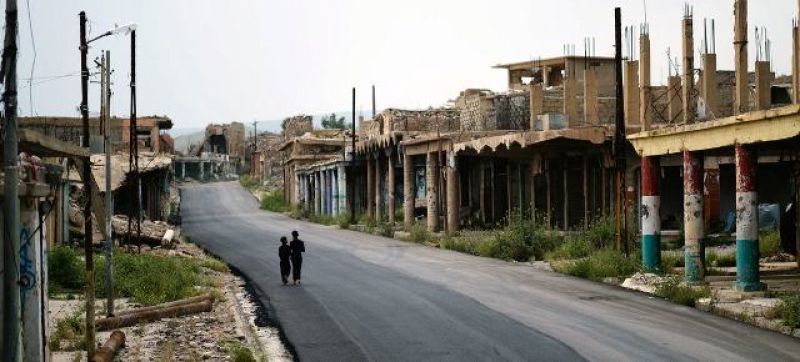 iraqi-children-walk-past-a-marketplace-in-sinjar-which-was-ruined-in-the-war-with-the-daesh-terrorist-network-otherwise-known-as-isil-c4d7404f1a20f5456adf56ebb5d2d2a31662738206.jpg