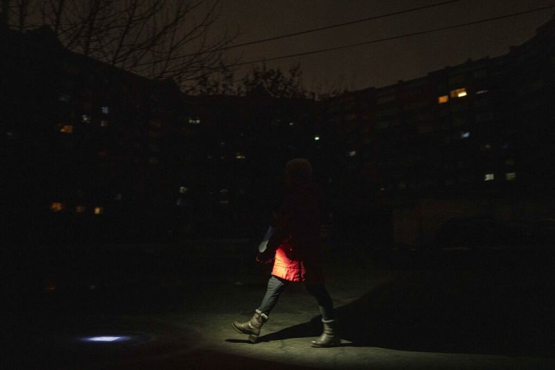 a-woman-lights-up-the-road-with-a-flashlight-during-blackout-in-kyiv-ukraine-friday-feb-5ff1d4ef92902ae424dd0db51fe8c42c1675571690.jpg