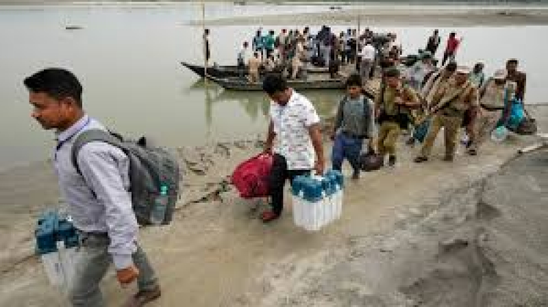 polling-officials-and-security-personnels-carry-electronic-voting-machines-evms-and-other-election-material-off-a-boat-in-baghmora-chapori-assam-on-thursday-april-18-2024-fb4593b3159e51f950cf6018d3d82e5e1713496403.jpg