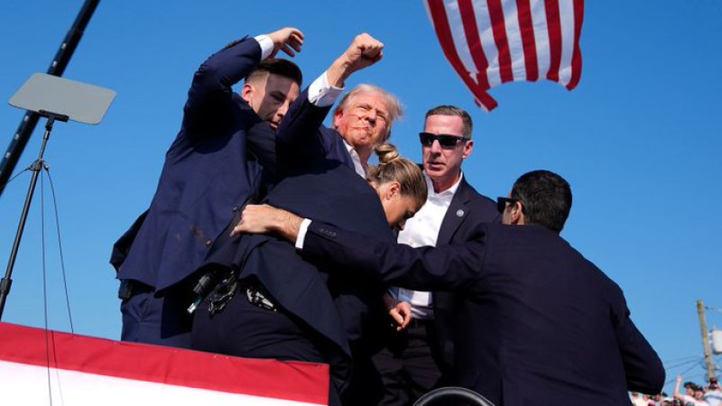 former-presidet-of-the-us-donald-trump-being-whisked-out-of-the-stage-by-secret-service-men-after-the-shooting-on-saturday-evening-809f33655a3562b2f49e54e3b6517be21720971698.png