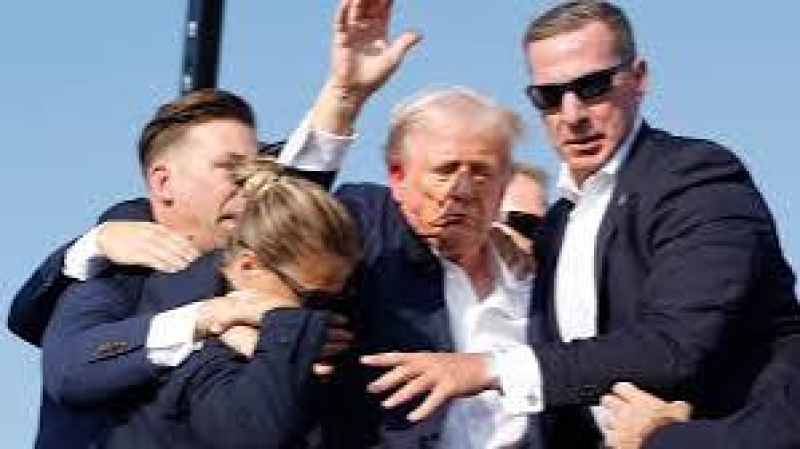 republican-candidate-former-us-president-donals-trump-being-whisked-away-from-the-rally-stage-by-secret-service-men-on-13-july-2024-6aea1b0a25d3bdd9083fbf89171d93841721066785.png