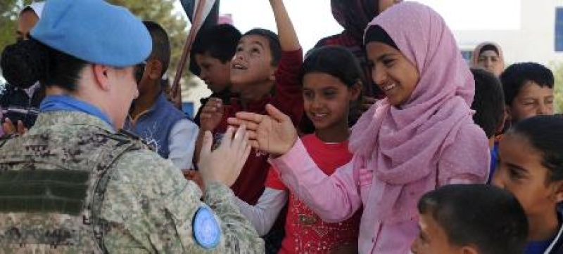 a-peacekeeper-greets-the-students-of-the-faouar-school-in-syria-which-was-one-of-the-four-schools-that-was-refurbished-by-the-un-disengagement-force-6a2e1250d9c7e9a247e0943f469d25161734070552.jpg