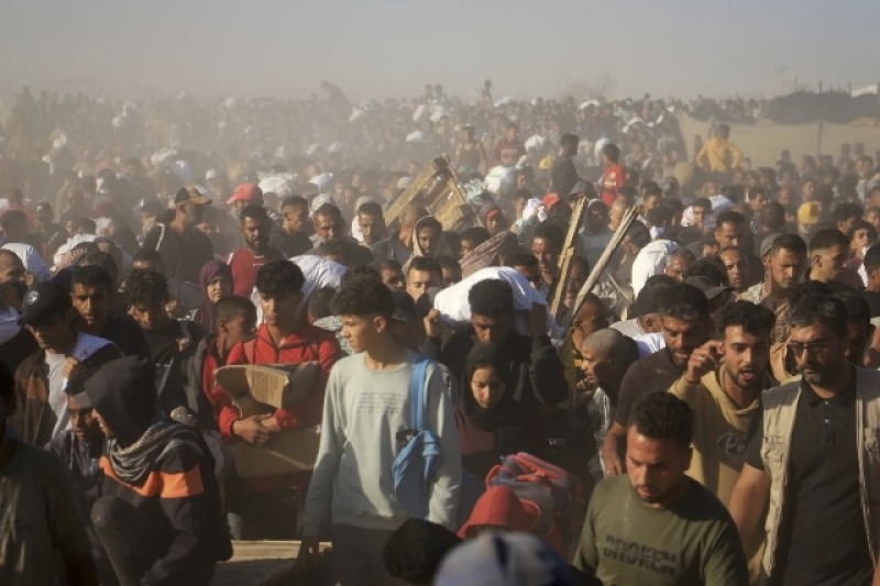 palestinians-carry-boxes-and-bags-containing-food-and-humanitarian-aid-packages-delivered-by-the-gaza-humanitarian-foundation-a-u-99eec6df231e5ba6a7f013fc5f5ea6aa1750010875.jpeg